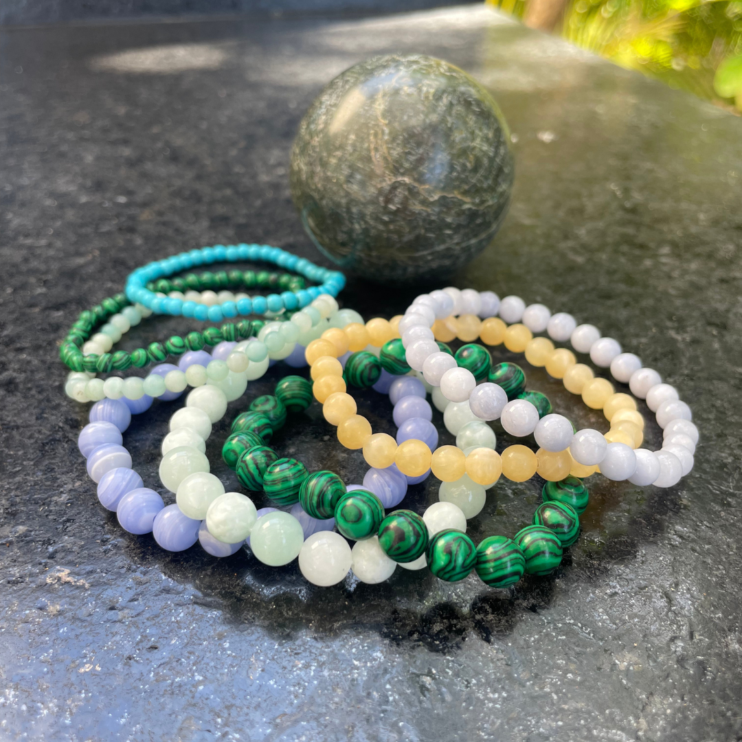 Stack of Colorful Crystal Bead Bracelets