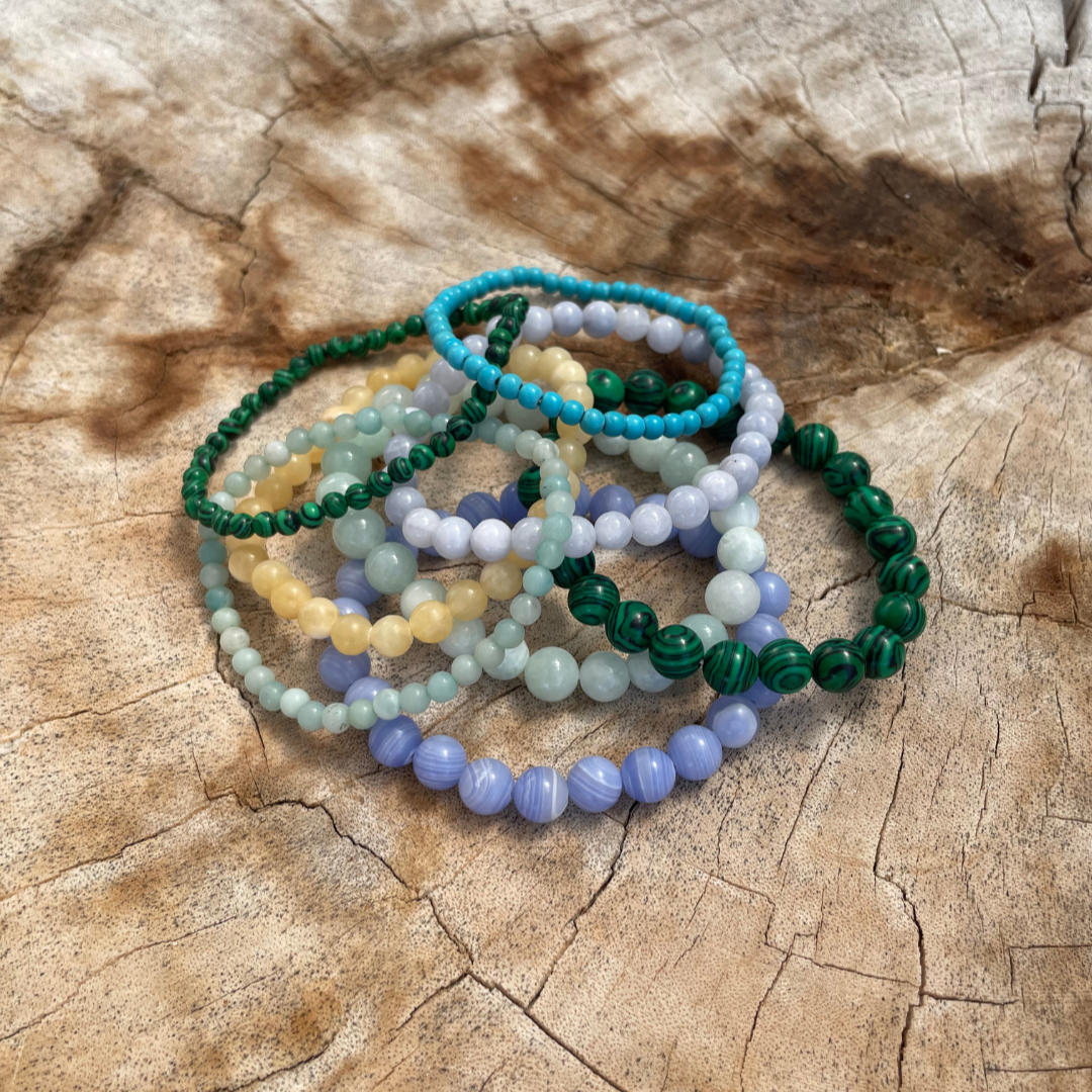Stack of Colorful Crystal Bead Bracelets