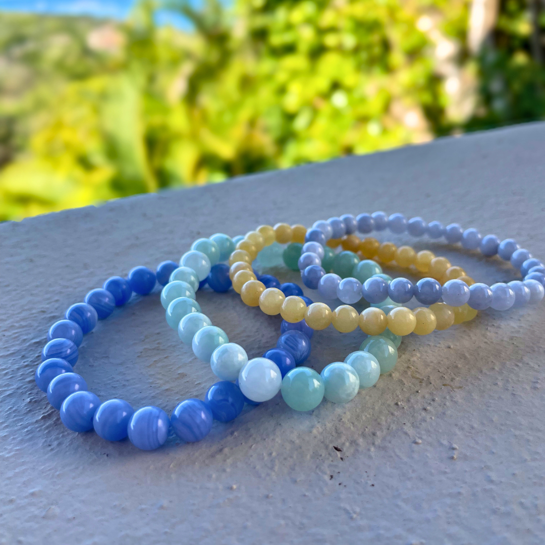 Stack of Colorful Crystal Bead Bracelets