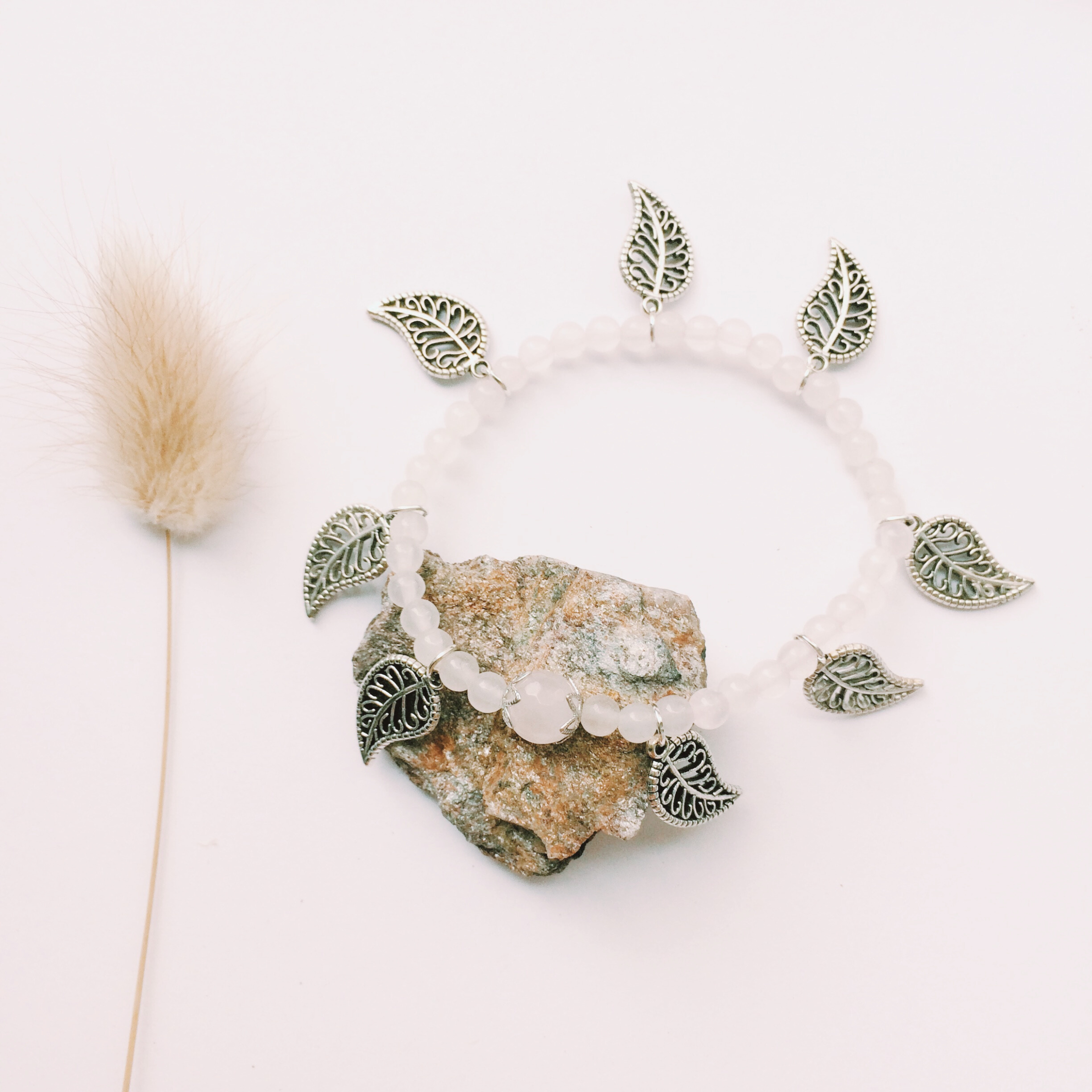 A White Headband with Silver Leaves and a Crystal
