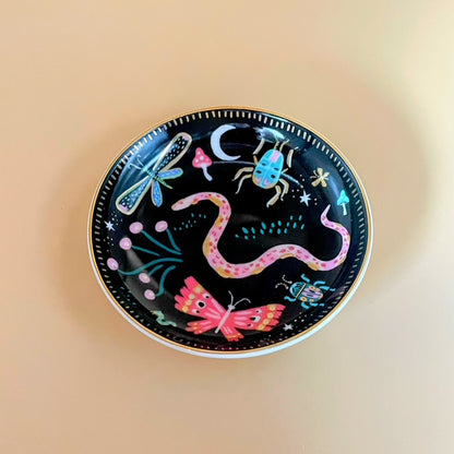 Step into an enchanting nightscape with the Enchanted Garden Trinket Tray