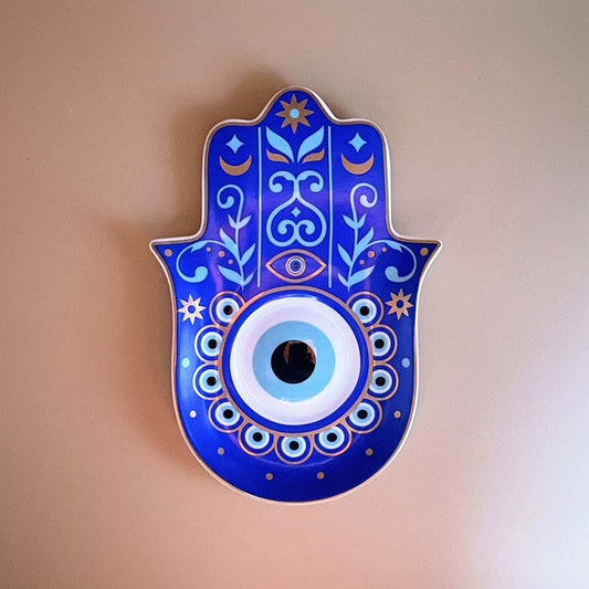 Introduce a timeless blend of symbolism and beauty to your home with the Blue Eyed Peacock Hamsa Plate