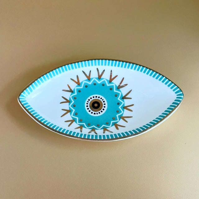 Bring balance, beauty, and protection into your space with the Guardian’s Eye Ceramic Trinket Tray