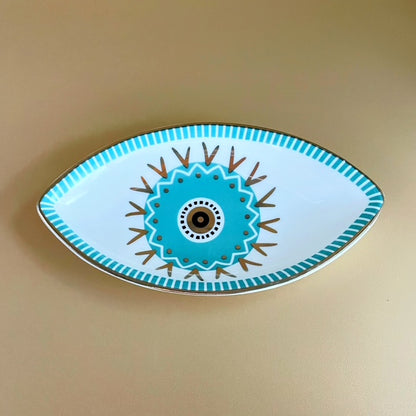 Bring balance, beauty, and protection into your space with the Guardian’s Eye Ceramic Trinket Tray